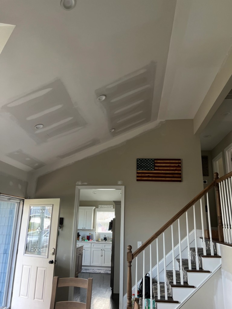 Dining room with vaulted ceiling during drywall mud and finishing work