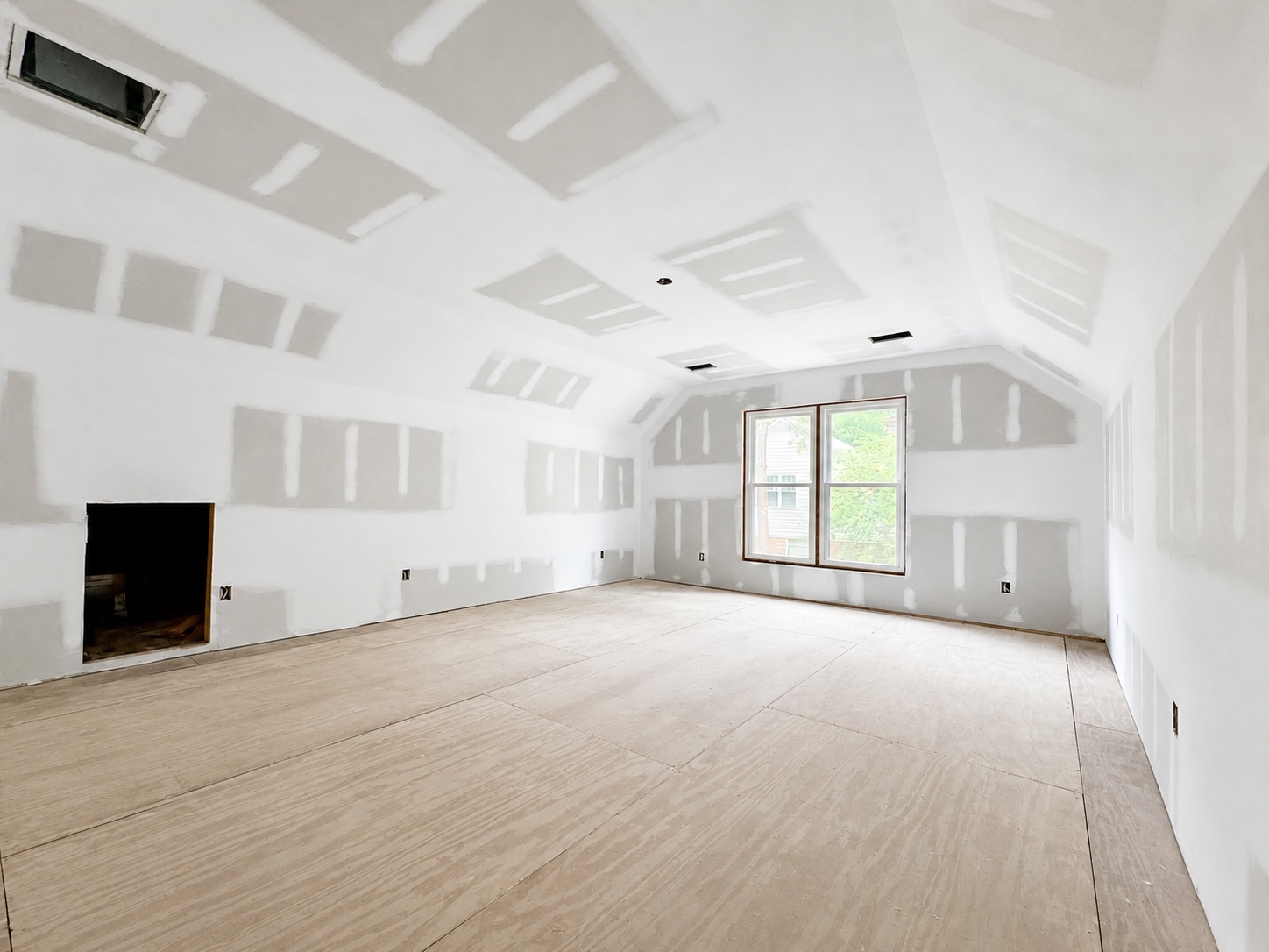 Cathedral ceiling drywall with straight finished lines near the high peak