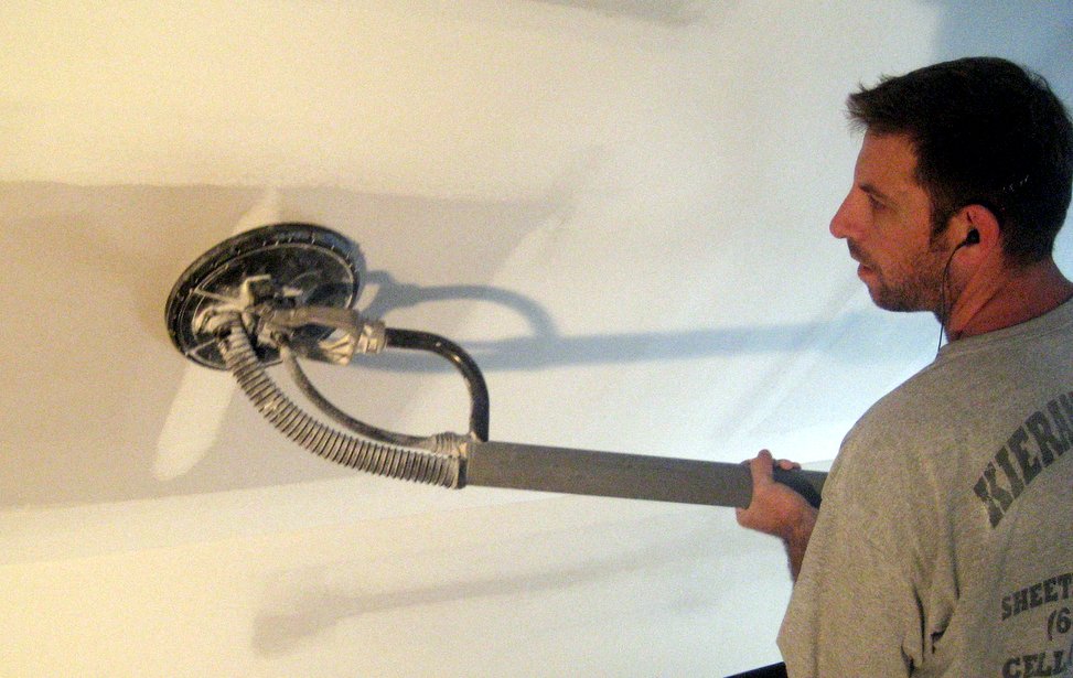drywall contractor with sander